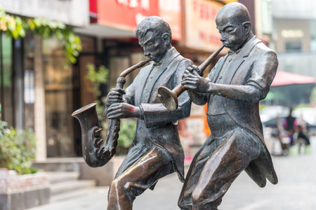 Statue of musician playing saxophone in Dafen Oil Painting village, Shenzhen, China.のeditorial素材