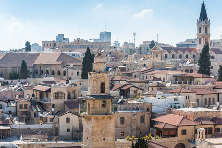 Aerial view of rooftops of buildings of Muristan area in the old city of Jerusalem. Minaret of...
