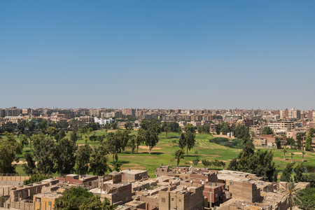 Aerial view of Cairo of red brick houses from the Giza pyramid complex, the Giza Necropolis, on the Giza Plateau in Greater Cairo, Egyptの写真素材
