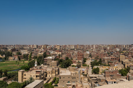 Aerial view of Cairo of red brick houses from the Giza pyramid complex, the Giza Necropolis, on the Giza Plateau in Greater Cairo, Egyptの写真素材