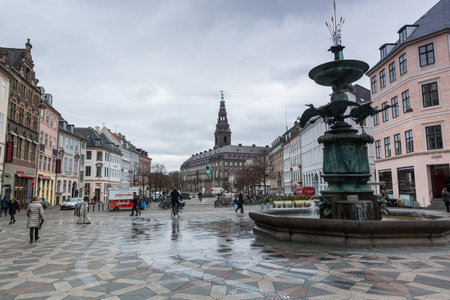 Street view with Stork Fountain is located on Amagertorv in central Copenhagen, Denmarkのeditorial素材