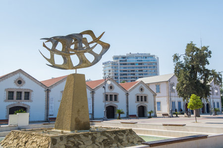 Golden flying seagull bird sculpture of fountain foinikoudes larnaca in front of Larnaca Municipal Art Gallery in Cyprus.のeditorial素材