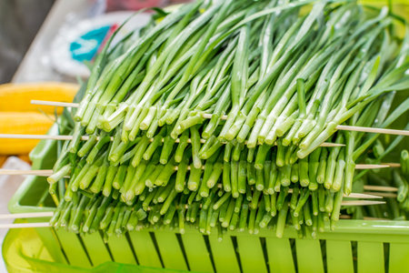 Green Chinese chives vegetable in row for barbecue