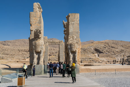 Lots tourists at the Ruins of the Gate of All Nations in the Persepolis in Shiraz, Iran. The ceremonial capital of the Achaemenid Empire.のeditorial素材