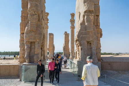 Lots tourists at the Ruins of the Gate of All Nations in the Persepolis in Shiraz, Iran. The ceremonial capital of the Achaemenid Empire.のeditorial素材
