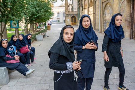 A group of Iran young girls wearing black Hijab at Golestan Palace, Tehran City, Iranのeditorial素材