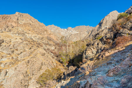 Barren mountain in Darband valley in autumn in the morning against blue sky in the Tochal mountain. A popular recreational region for Tehran's residentsの写真素材