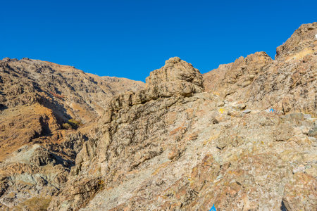 Barren mountain in Darband valley in autumn in the morning against blue sky in the Tochal mountain. A popular recreational region for Tehran's residentsの写真素材