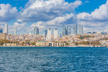 Cityscape of Golden horn with ancient and modern buildings in Istanbul Turkey from the Bosphorus strait on a sunny day with background cloudy skyのeditorial素材