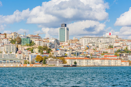 Cityscape of Golden horn with ancient and modern buildings in Istanbul Turkey from the Bosphorus strait on a sunny day with background cloudy skyのeditorial素材