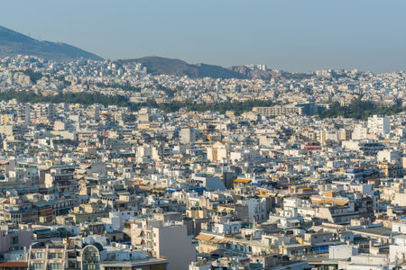 Aerial view of cityscape with crowded buildings of Athens in a sunny day in Greeceのeditorial素材