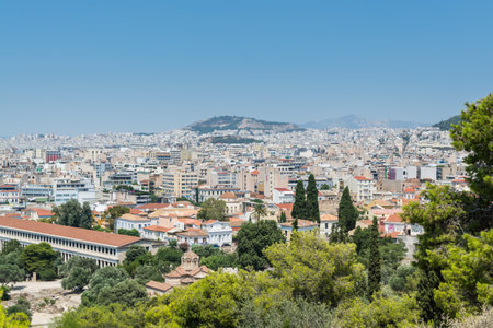Aerial view of cityscape near Acropolis with crowded buildings of Athens with Stoa of Attalos in a sunny day, view from Greece Areopagus Hillのeditorial素材