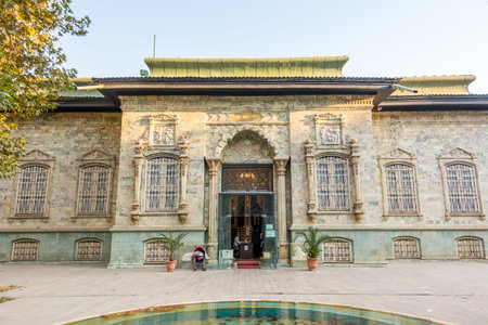 Historic building of green palace (Shahvand House) of Iranian visitor walking in Sa'dabad palace...