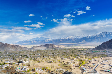 Aerial view of Leh Ladahk City of Kashmir with background of Himalaya mountain against blue sky, view from the Shanti Stupaの写真素材