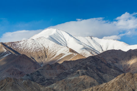 Himalayas mountain covered by white snow, against blue sky, from the view of Shanti Stupa, Leh city, Ladakh of Jammu and Kashmirの写真素材