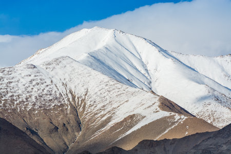 Himalayas mountain covered by white snow, against blue sky, from the view of Shanti Stupa, Leh city, Ladakh of Jammu and Kashmirの写真素材