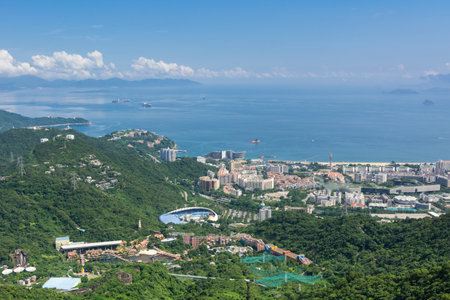 Beautiful coastline and villas in Shenzhen Bay against cloudy sky, View from Overseas Chinese Town East (OCT East) in Shenzhen, Guangdong, China.の写真素材