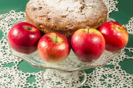 Applesauce raisin rum cake for christmas table. Table decorated with lacy snowflakes and napkin. From series of "Merry Christmas"の写真素材