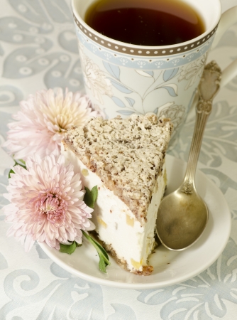 Ricotta and Pear Cake with cup of tea and bouquet of chrysanthemums. From the series "Italian desserts"の写真素材