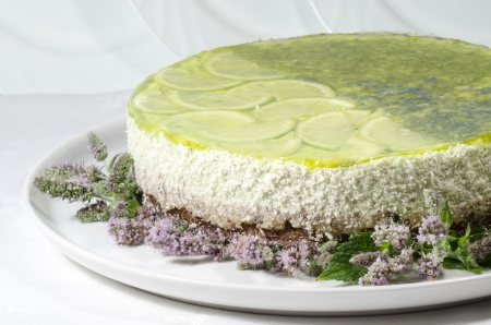 Lime cheesecake decorated with mint flowers. From series "Summer desserts"の写真素材