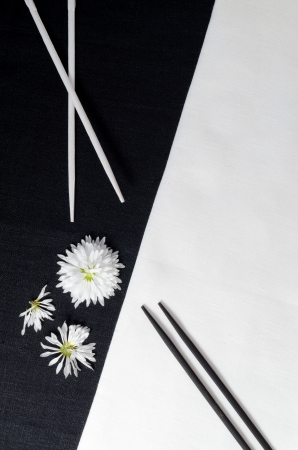 White porcelain on black and white linen tablecloths. White porcelain on black and white linen tablecloths. Abstract still life. From series "Playing with Color"の写真素材