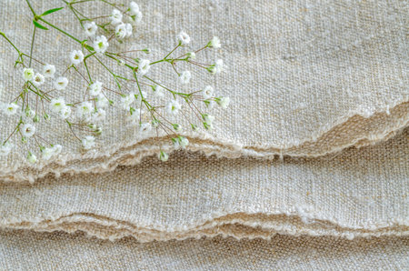 Still life with bouquet flowers on linen tablecloths Overhead view. selective focus