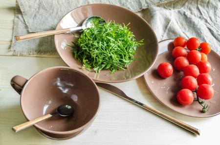Ingredients watercress salad with cherry tomatoes. From series Natural organic foodの写真素材