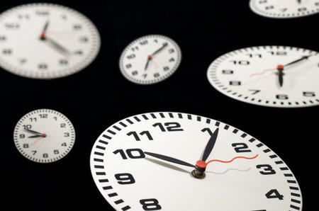 lots of clocks floating on black background