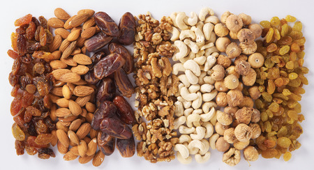 Varieties of nuts on white as a backgroundの写真素材