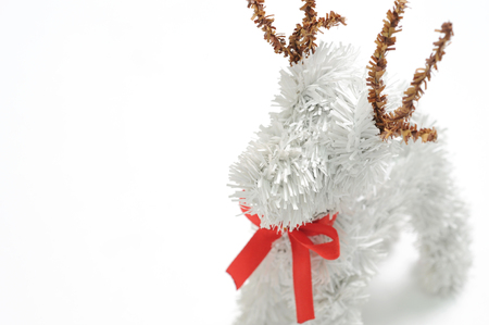 christmas ribbon and deer on white spaceの写真素材