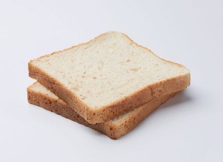Two slices of bread on white background