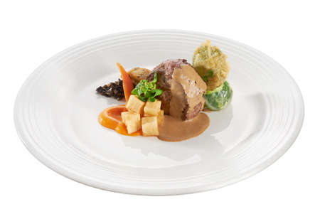 Fine dine serving grilled steak with vegetable, topped with creamy gravyの写真素材