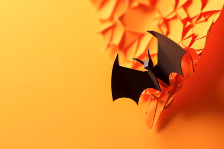 Banner with a paper bat on orange background top view with copy space, halloween concept. Generative AI.の素材