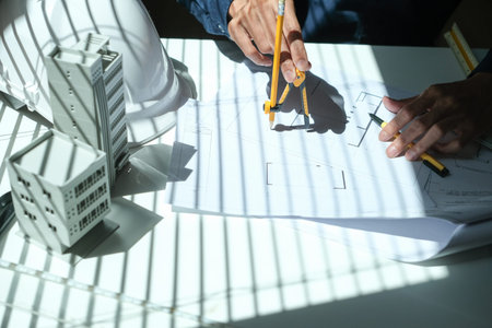 Architectural engineer man, contractors, designers, sketches, blueprints and construction work for...