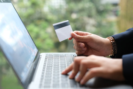 woman uses smart tablet computer and holds credit card with online shopping.Online payment concept.の写真素材