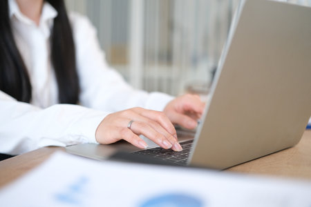 Woman using laptop computer at home.の写真素材