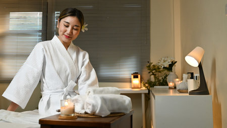 Beautiful young woman relaxing in spa salon.の写真素材