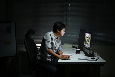 businessman working in the office in the late night during overtime period. Deadline concept.and overwork.の写真素材