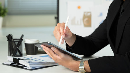 Person Using Tablet for Signature, Modern Business and Technology Concept, Close Up.