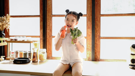 little girl using carrots and broccoli as microphones..の写真素材