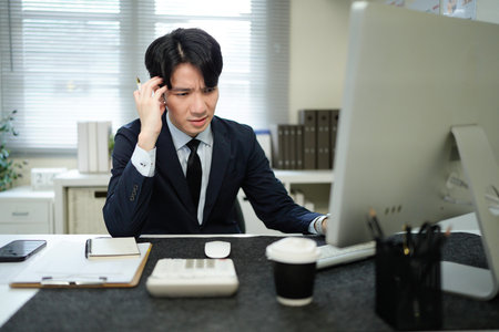 Burnout, headache and tired business man in anxiety, mental health problem and bankruptcy crisis. Sad, frustrated and stressed male with fatigue, depression and risk of debt.の写真素材