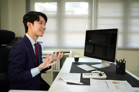 Businessperson using AI Agent virtual assistant with voice waveform interface. Concept of artificial intelligence support, voice bot, smart customer service, and virtual assistant automation..の写真素材