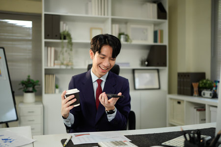 Businessperson using AI Agent virtual assistant with voice waveform interface. Concept of artificial intelligence support, voice bot, smart customer service, and virtual assistant automation..の写真素材