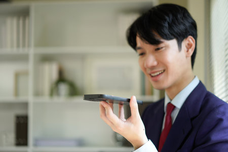 Businessperson using AI Agent virtual assistant with voice waveform interface. Concept of artificial intelligence support, voice bot, smart customer service, and virtual assistant automation..の写真素材