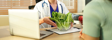 Nutritionist giving consultation to patient with healthy fruit and vegetable, Right nutrition and diet concept.の写真素材