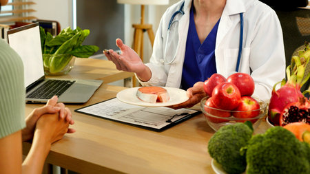 Dietician, male nutrition specialist consulting woman, developing healthy diet, dietary program....