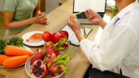 The healthcare professional providing nutritional guidance to a patient, developing healthy diet,...