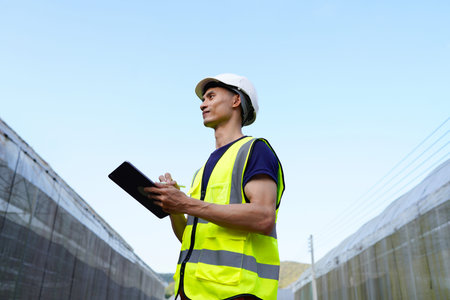 Construction, engineer and man with tablet for agriculture, project development and research....