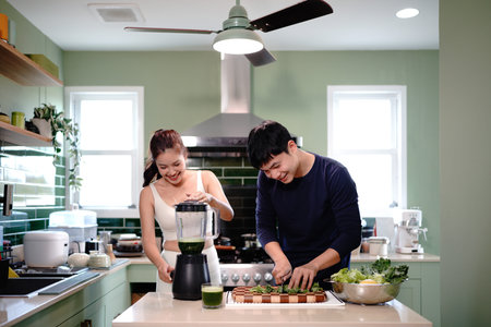 health and couple with smoothie in kitchen at home for wellness, diet and nutrition snack. Love,...