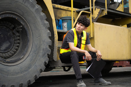 Engineer or Factory worker feeling tired from hard work in a factory, weak, hopeless, burned out, Fired Unemployed Feeling Stressed.